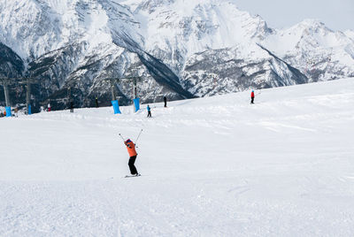 Full length of man skiing on snowcapped mountain