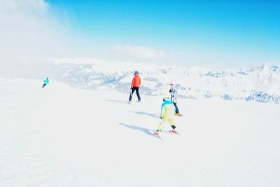Tourists enjoying on snow covered landscape
