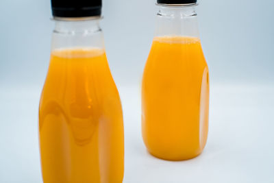 Close-up of orange juice on table