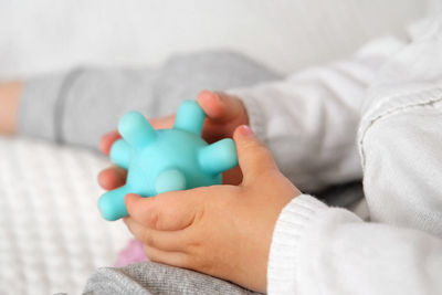 Midsection of woman playing with toy