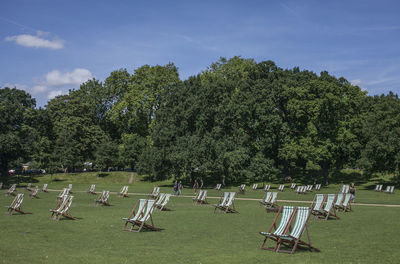 Scenic view of trees on field against sky