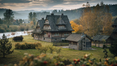 Panoramic view of houses and buildings against sky