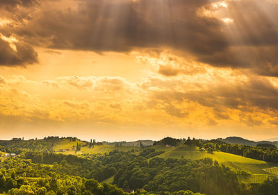 Scenic view of landscape against dramatic sky