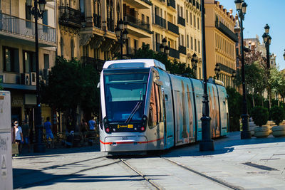 Cars on street amidst buildings in city