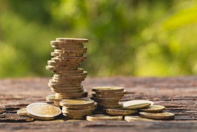 Close-up of stacked coins on table