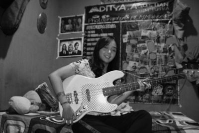 Young woman playing guitar