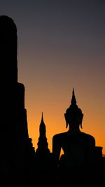 Silhouette of temple against sky during sunset