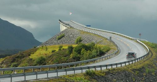 View of mountain range against cloudy sky