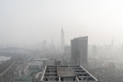 Modern buildings in city against sky