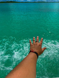 Low section of woman feet in swimming pool
