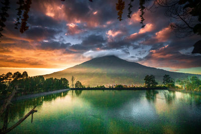 Scenic view of lake against sky during sunset