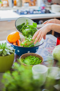 Close-up of person preparing food in bowl