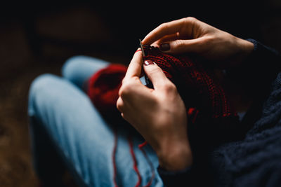 Midsection of woman holding hands