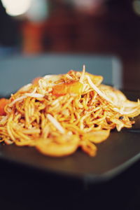 Close-up of noodles in plate on table