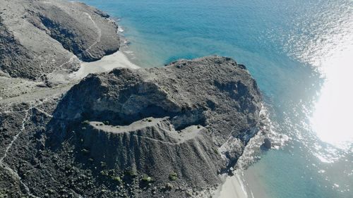 High angle view of rocks by sea