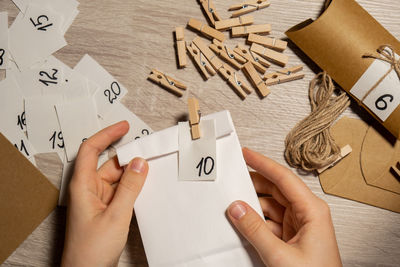 Cropped hands of person working on table