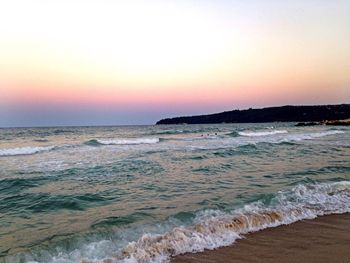 Scenic view of sea against clear sky during sunset