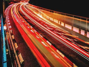 High angle view of light trails on road at night