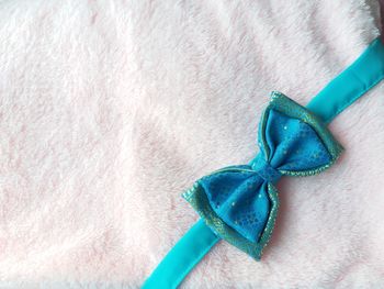 High angle view of tied bow on towel
