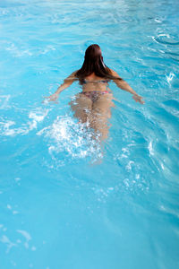 Woman swimming in pool