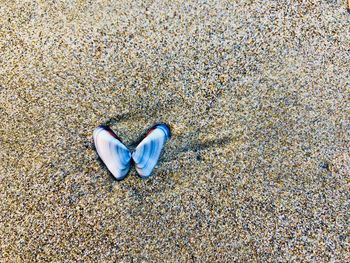 High angle view of heart shape on sand