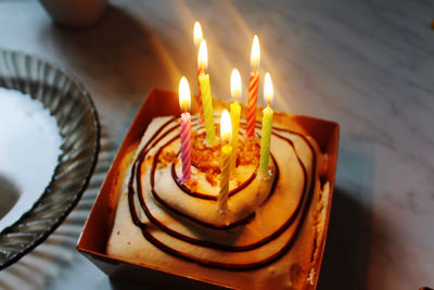 Burning candles on birthday cake
