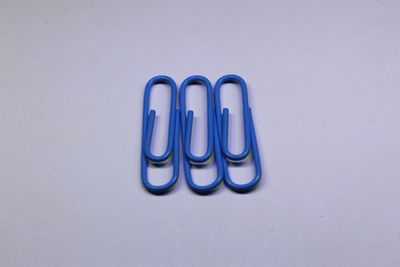 High angle view of blue paint on table against white background