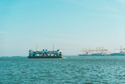 Ship in sea against clear sky