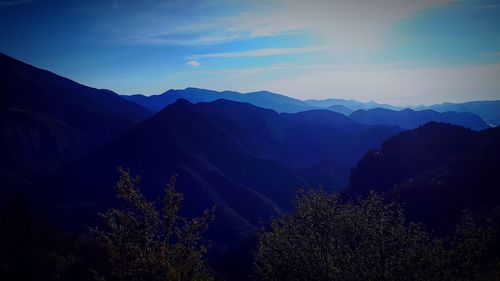 Scenic view of silhouette mountains against sky