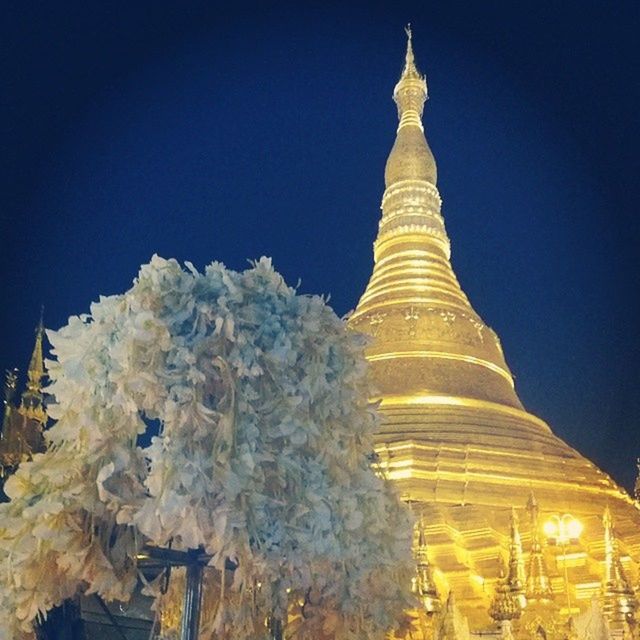 clear sky, famous place, low angle view, religion, copy space, travel destinations, blue, travel, spirituality, international landmark, place of worship, tourism, architecture, built structure, building exterior, night, illuminated, temple - building, outdoors