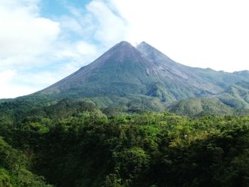 Scenic view of mountain against cloudy sky