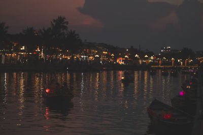 Scenic view of lake against sky at night