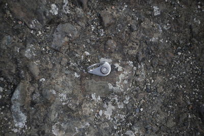High angle view of machine part on rock