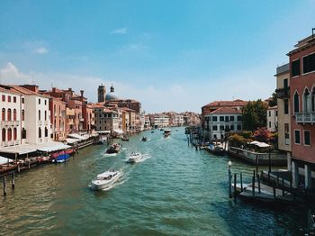 Canal passing through city buildings