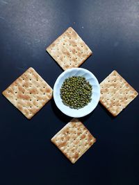 High angle view of food on table against black background