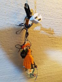Close-up of toy hanging on wall