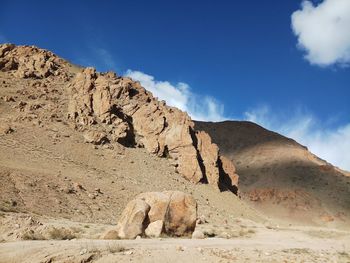 Low angle view of rock formations against sky