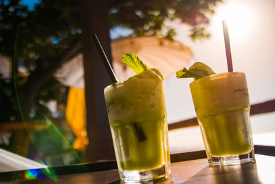 Close-up of fresh mojitos served on table in restaurant