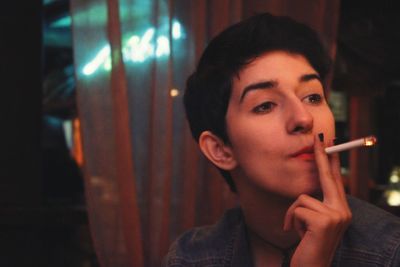 Close-up of woman smoking cigarette