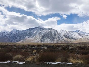 View of snowcapped mountain against cloudy sky