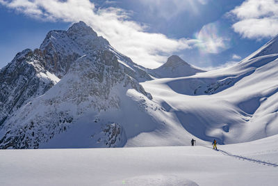 Scenic view of snow covered mountain against sky