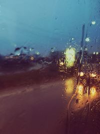 Road seen through wet glass