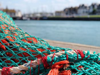 Close-up of fishing net at harbor