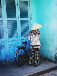 Woman against blue sky