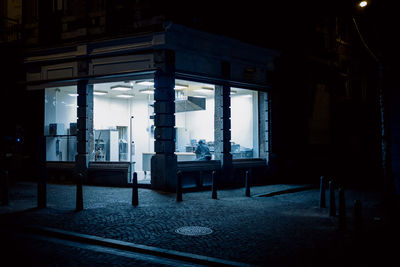 Empty chairs and table in building