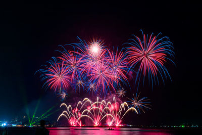 Firework display at night