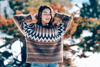 Portrait of a smiling young woman in winter