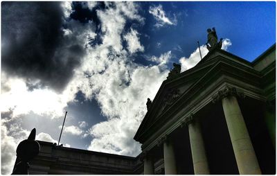 Low angle view of statue against cloudy sky