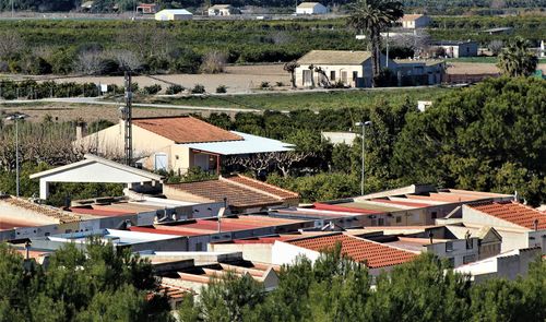 High angle view of houses and buildings in town