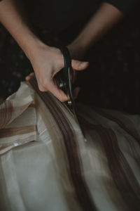 Close-up of woman hand holding wood